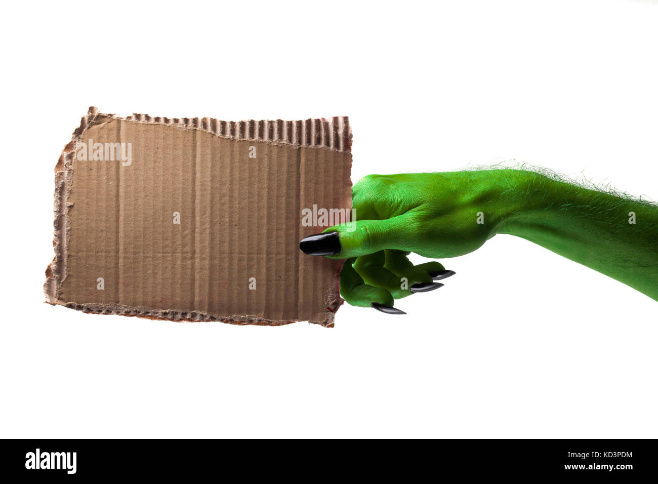 Halloween streghe verdi o zombie monster mano che tiene un cartello bianco Foto Stock