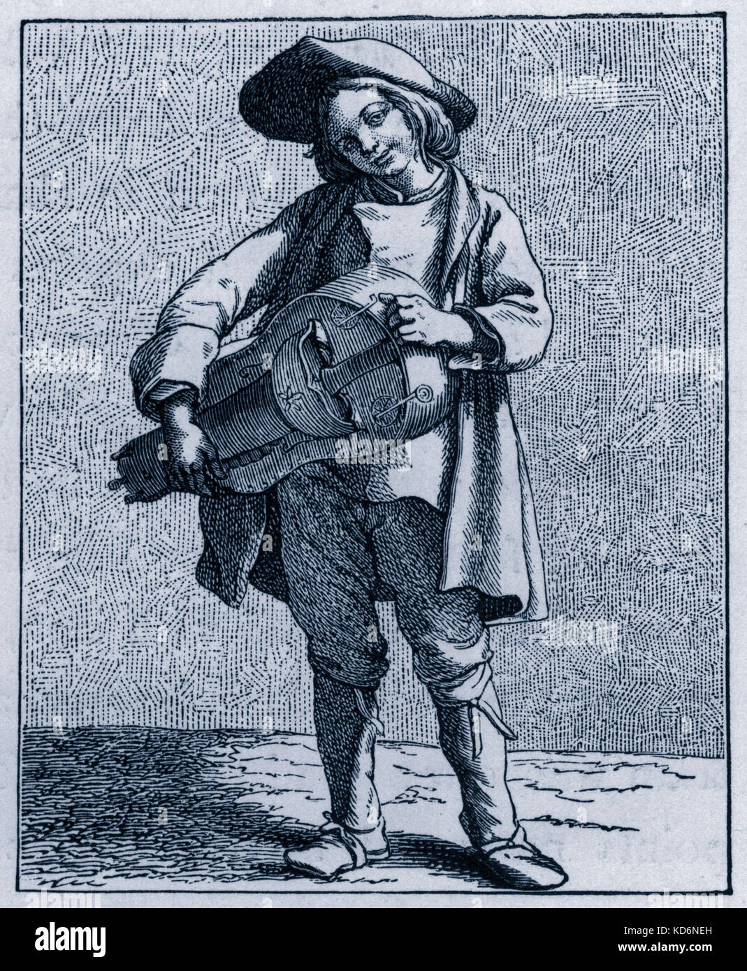 La vita quotidiana nella storia francese: una ghironda lettore / musicista di strada nel XVIII secolo a Parigi, Francia. Classe operaia, poveri, rustico, sostentamento, durante il regno di Luigi XV. Commercio, commercianti, commercio, merce. Foto Stock