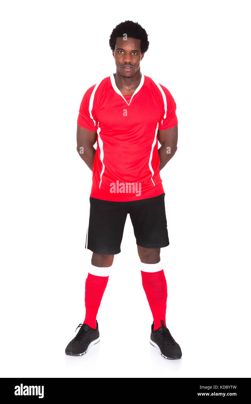 Ritratto di African soccer player isolate su sfondo bianco Foto Stock