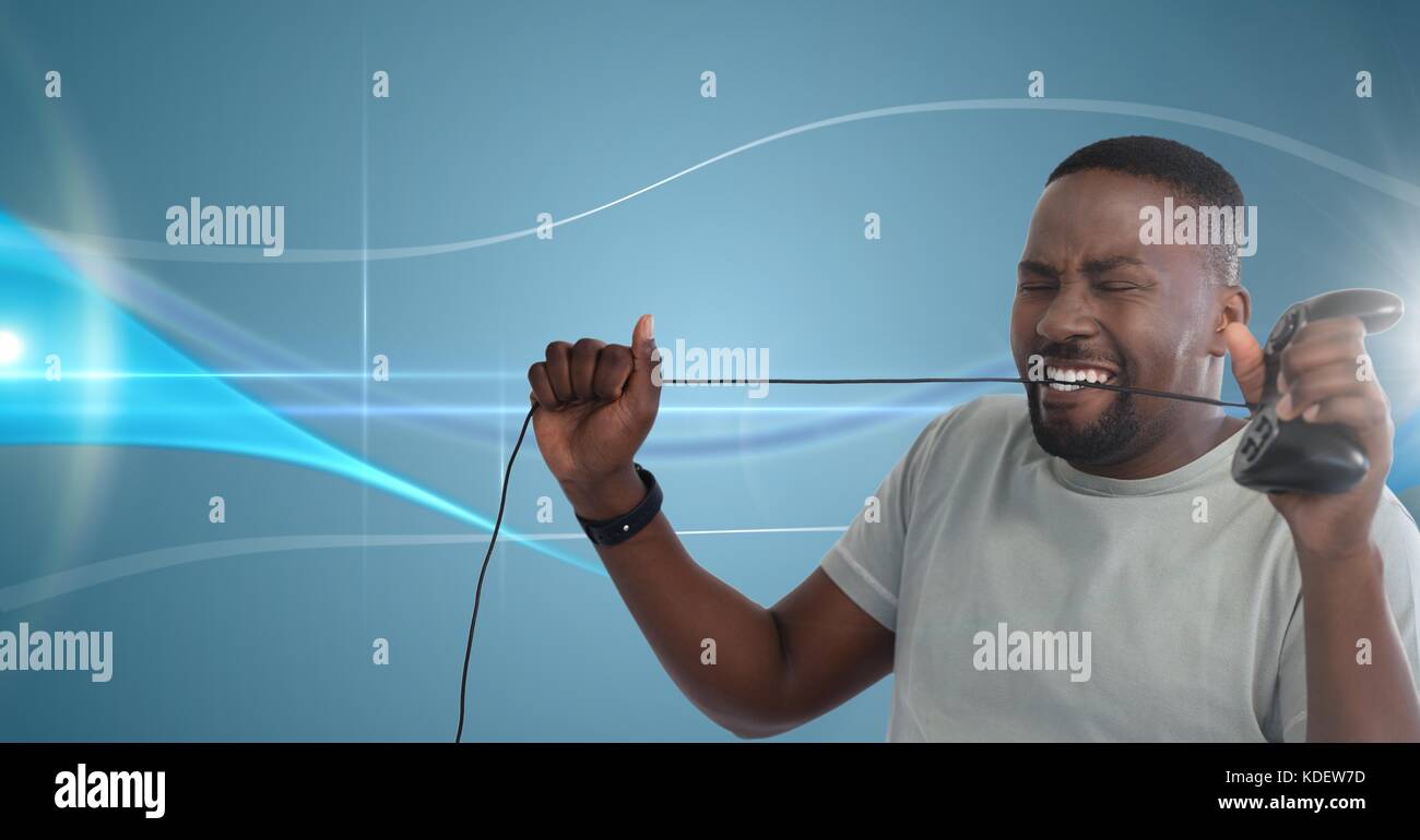 Digital composito di frustrato uomo giocando con il computer controller di gioco Foto Stock