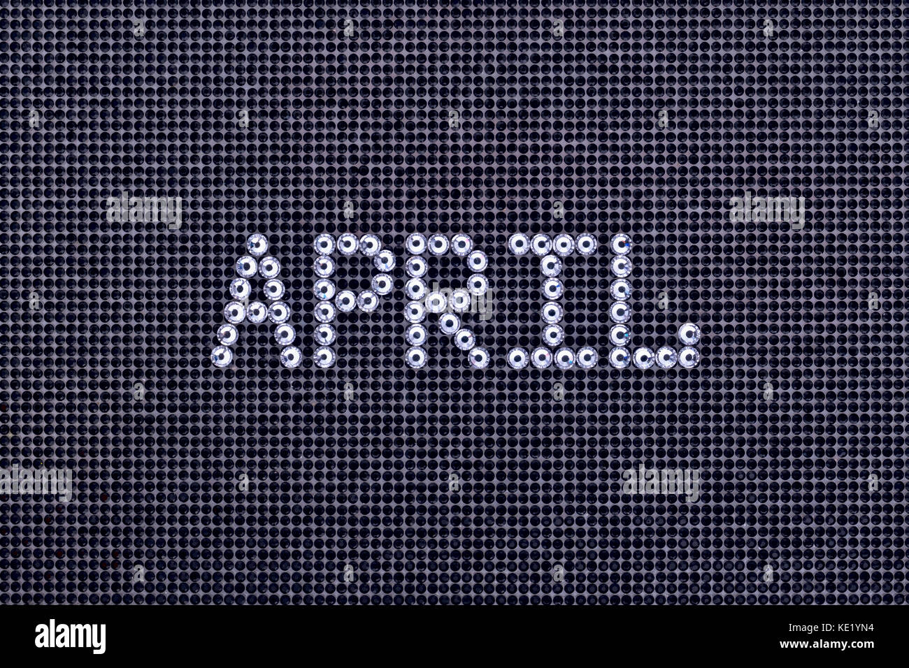 Mese aprile è realizzato strass colore cristallo su una tela nera sullo sfondo Foto Stock