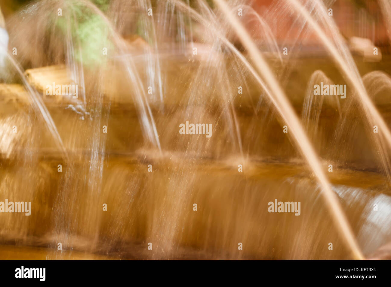 Sfocato sfondo astratto con pattern di getti di fontana Foto Stock