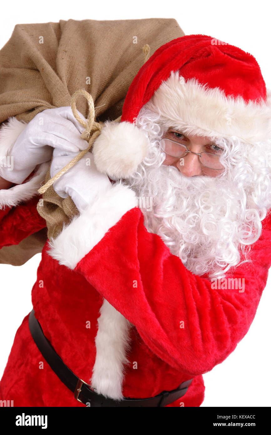 Babbo Natale che porta grande sacco sulle spalle pieno di regali di natale  Foto stock - Alamy