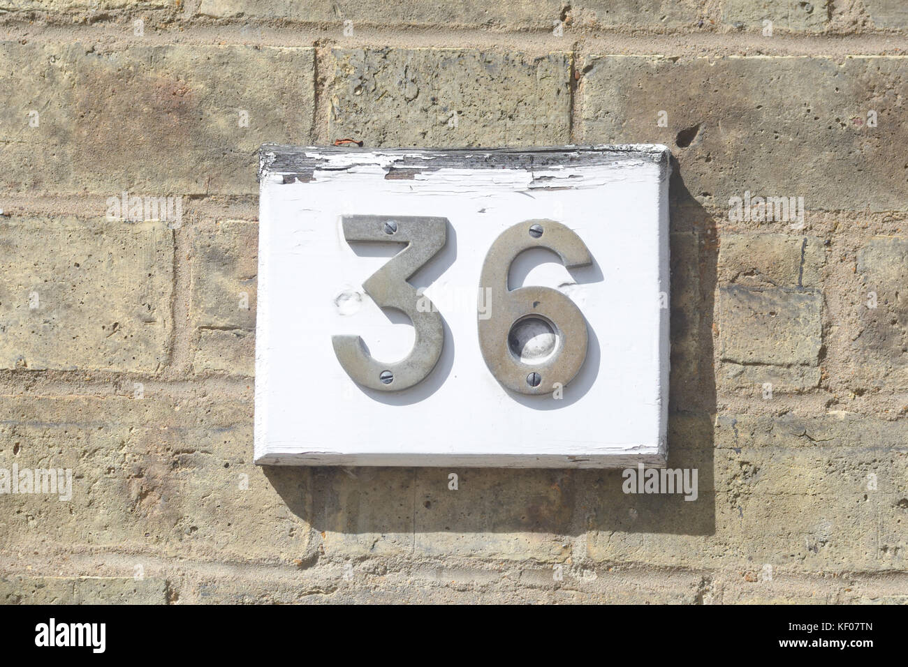 Casa numero 36 segno sulla parete Foto Stock