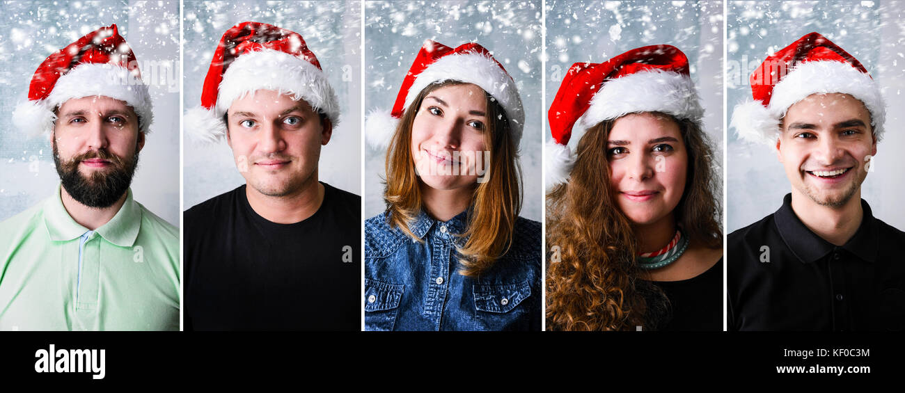 Persone che indossano santa hat Foto Stock