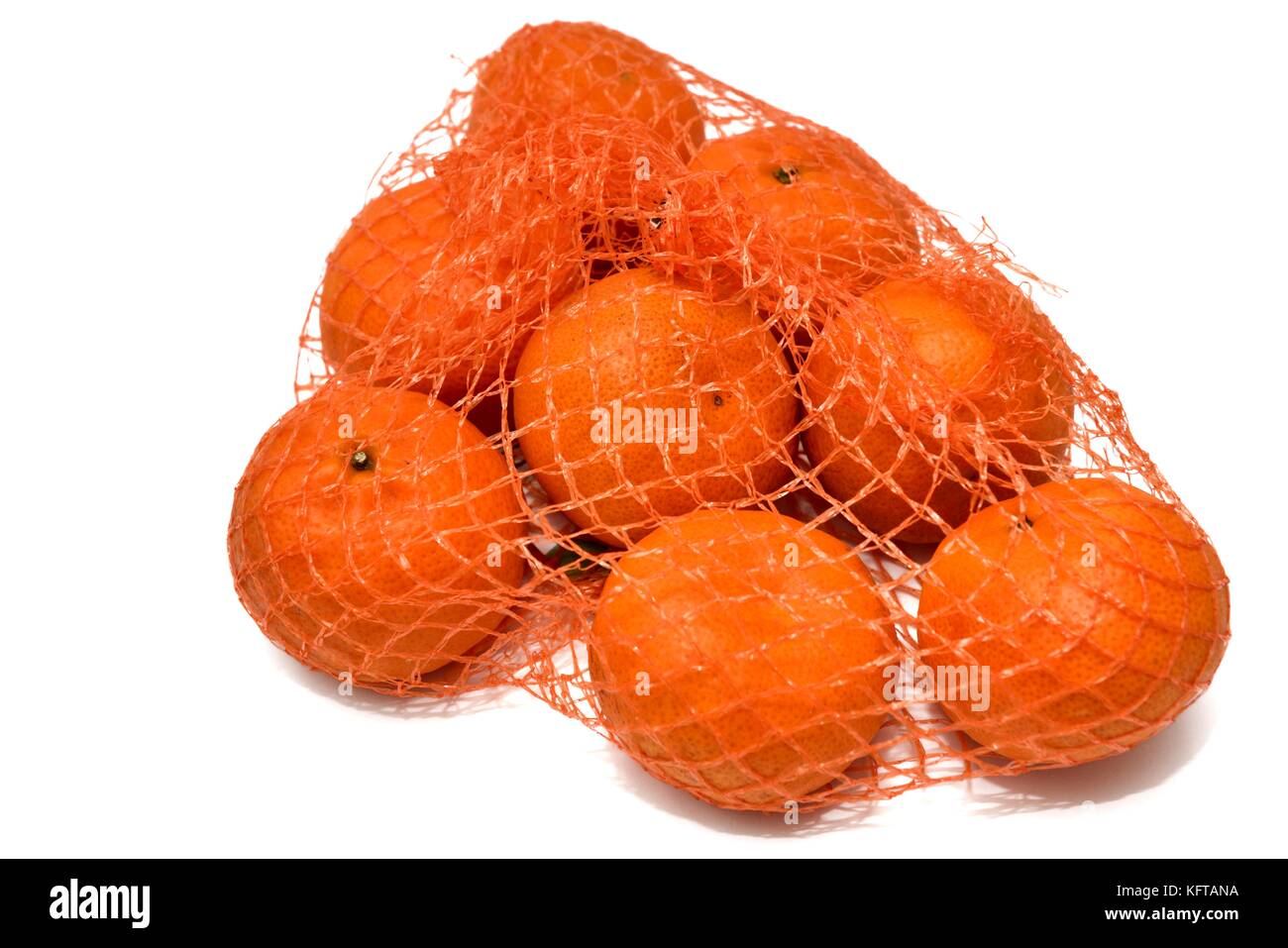 Una rete di arance clementine Foto Stock