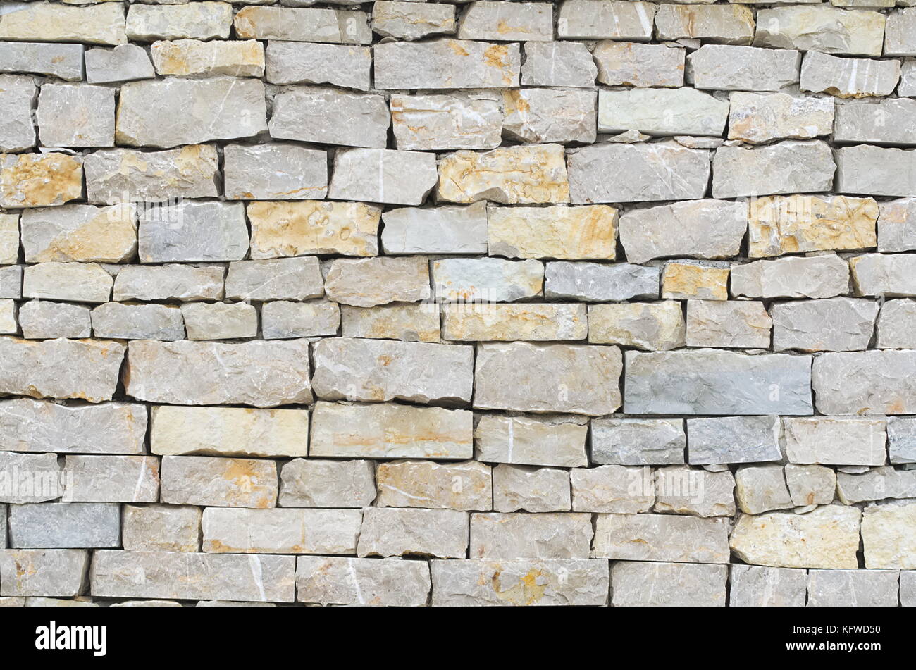 Grigio e marrone a muro di pietra closeup sfondo Foto Stock