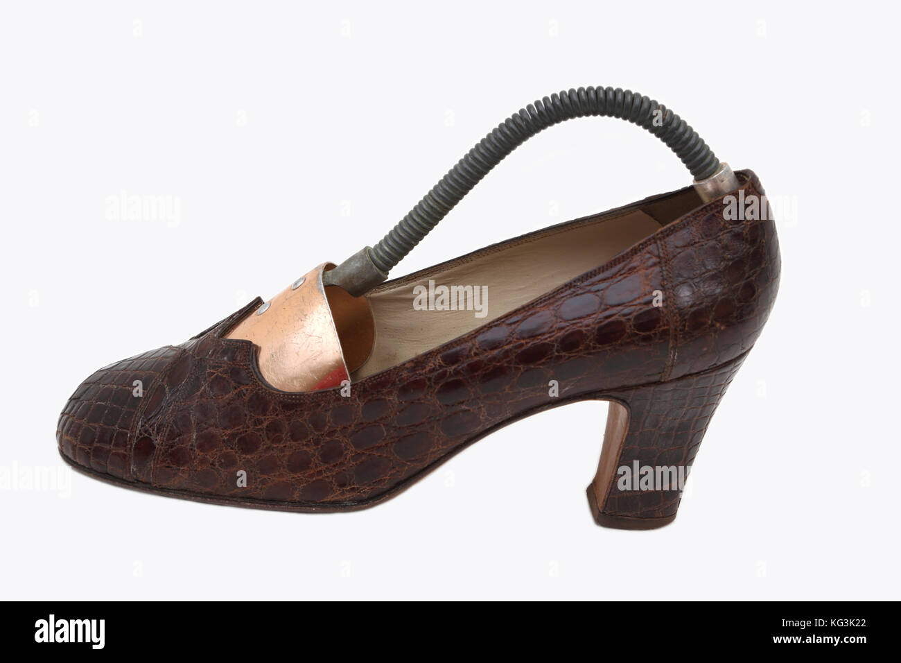 Snakeskin marrone tacco alto scarpa con molla albero cassoncino di pulizia Foto Stock