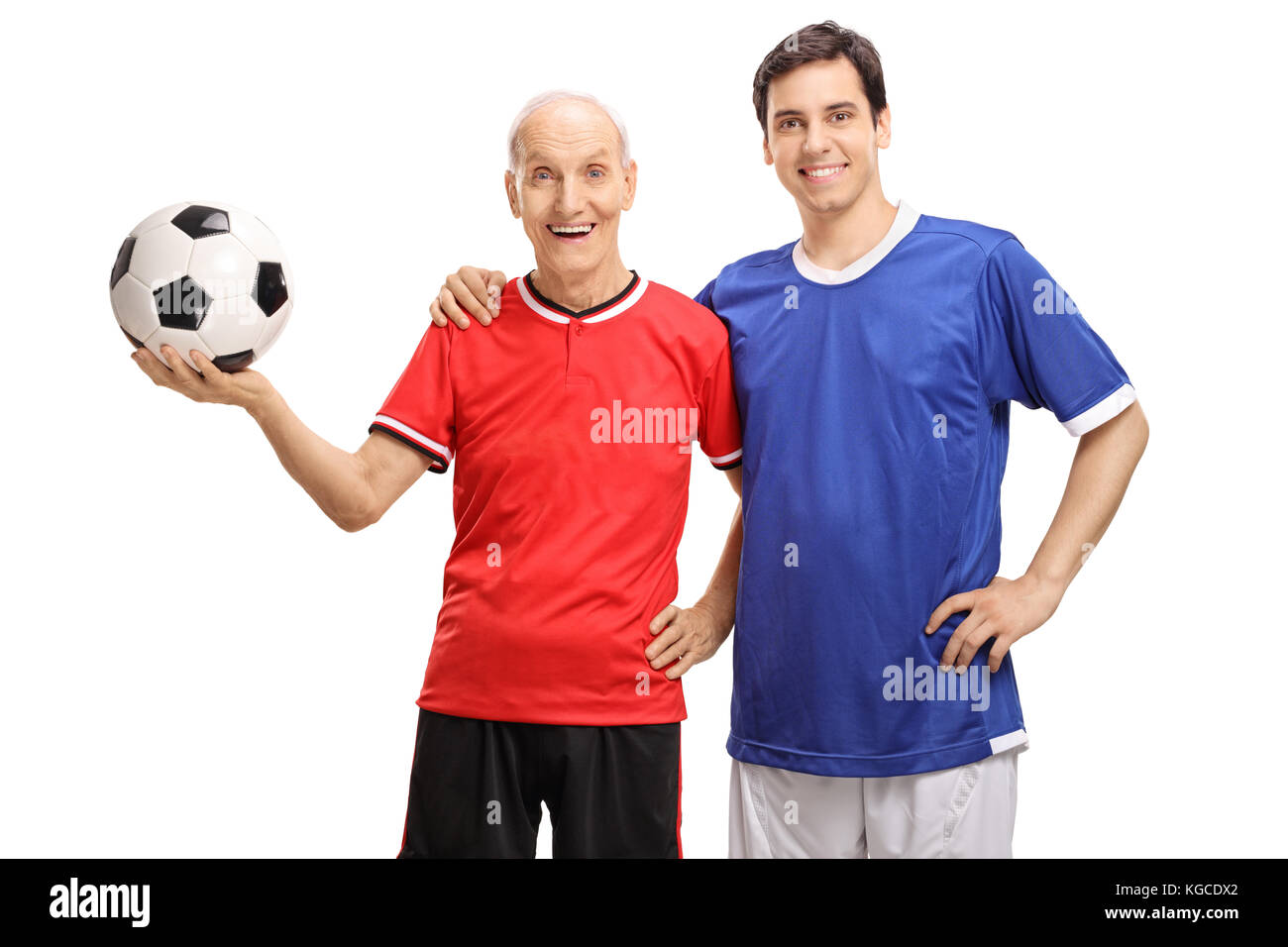 Vecchio giocatore di calcio e un giovane giocatore di calcio isolati su sfondo bianco Foto Stock