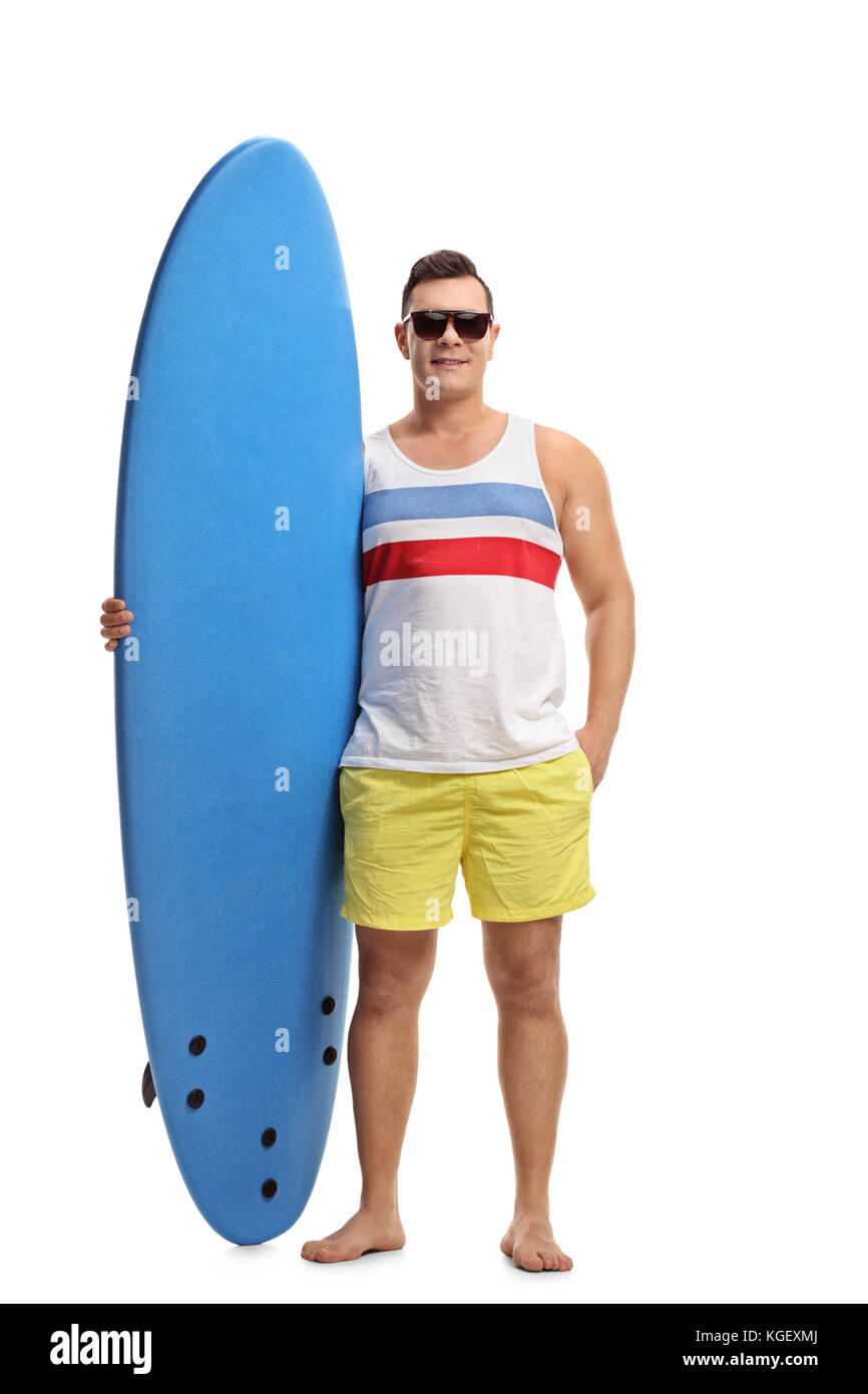 A piena lunghezza Ritratto di una giovane con una tavola da surf isolati su sfondo bianco Foto Stock