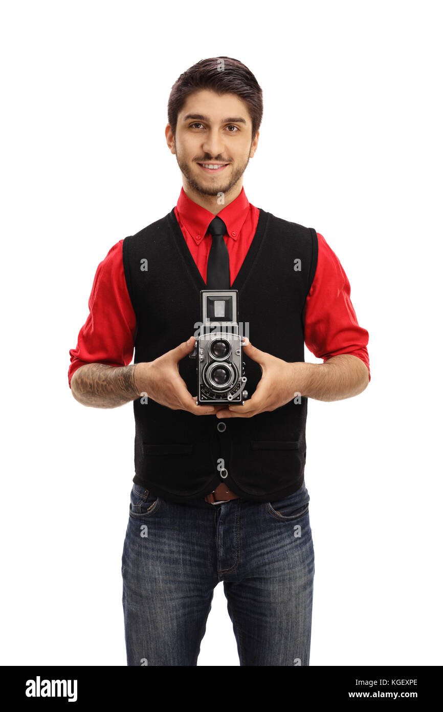 Tatuato guy tenendo una fotocamera vintage isolati su sfondo bianco Foto Stock