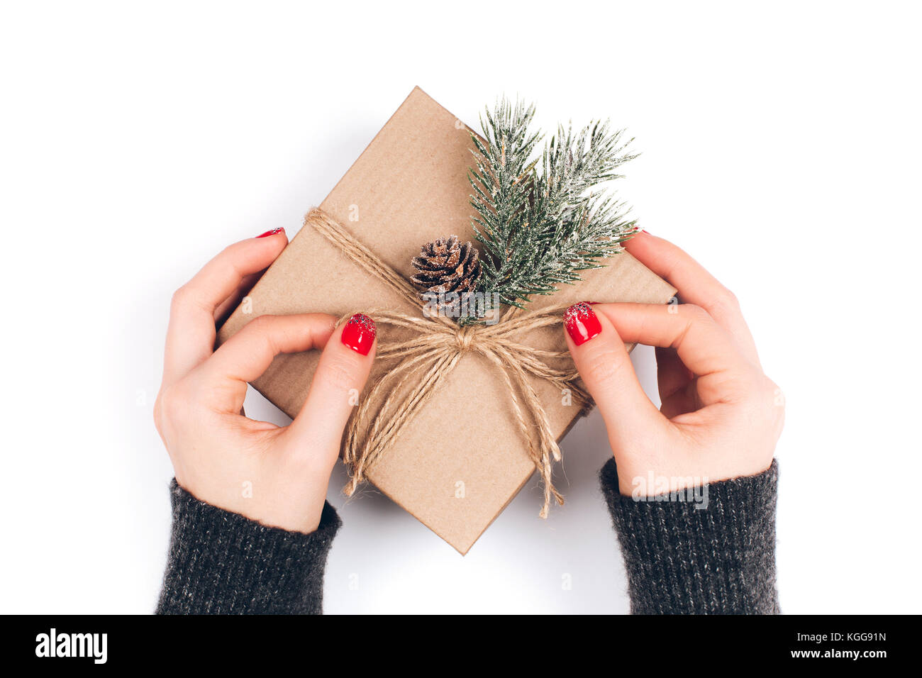 Donna di mani di natale di incarto confezione regalo Foto Stock