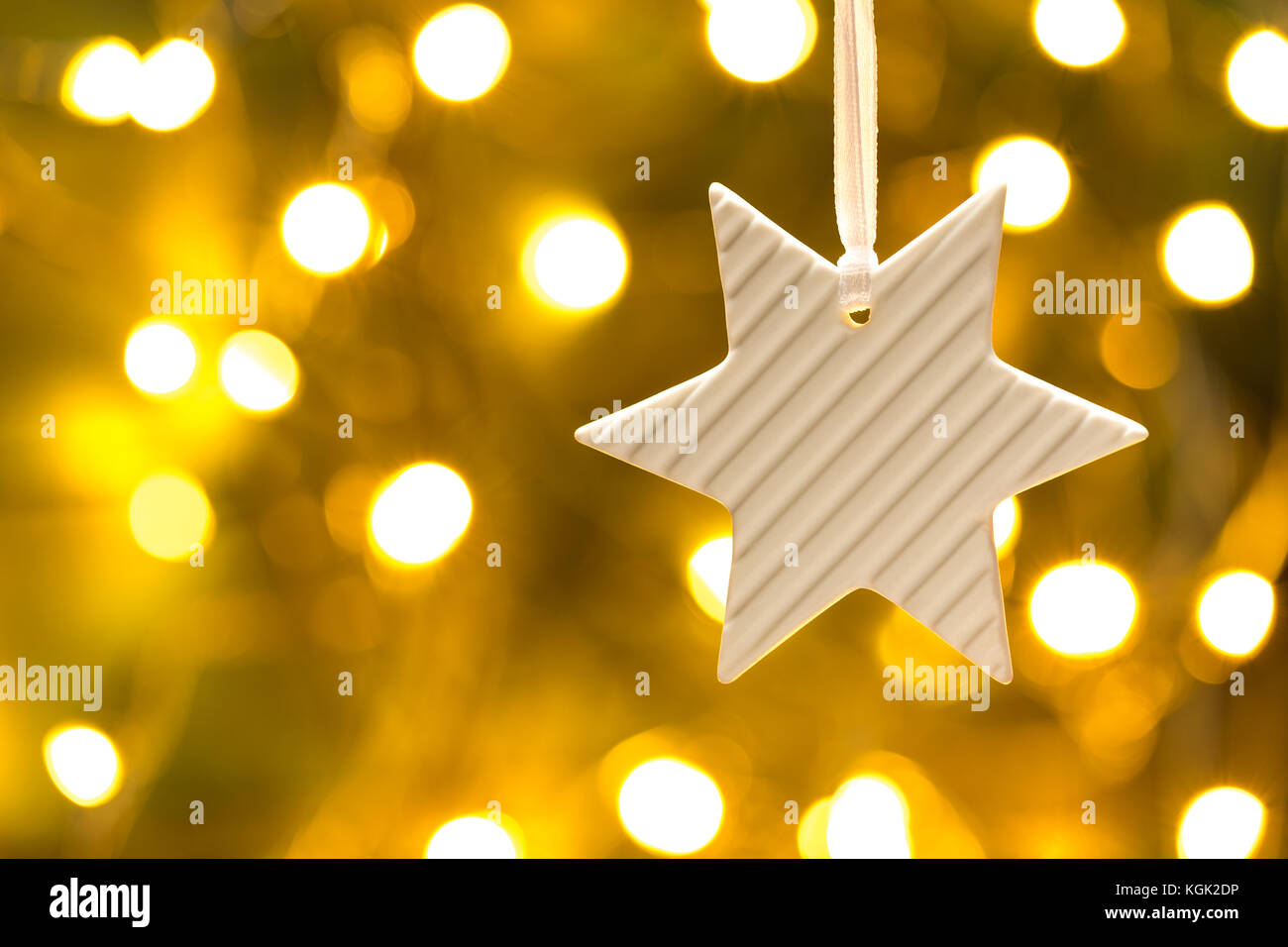 Scheda di Natale con Stella Dorata e luci. Foto Stock
