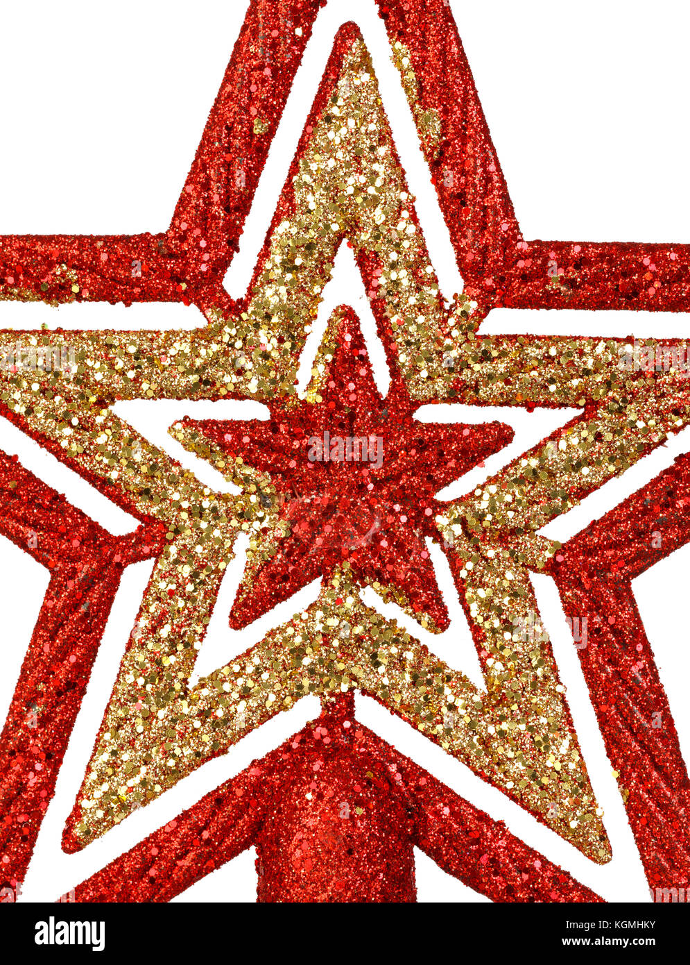 Rosso brillante e Golden Star per la parte superiore dell'albero di natale isolato su uno sfondo bianco Foto Stock