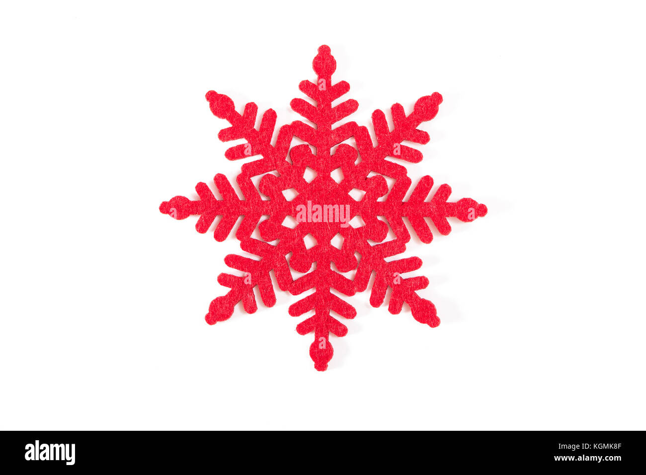 Rosso fiocco di neve decorativa, su sfondo bianco. Foto Stock