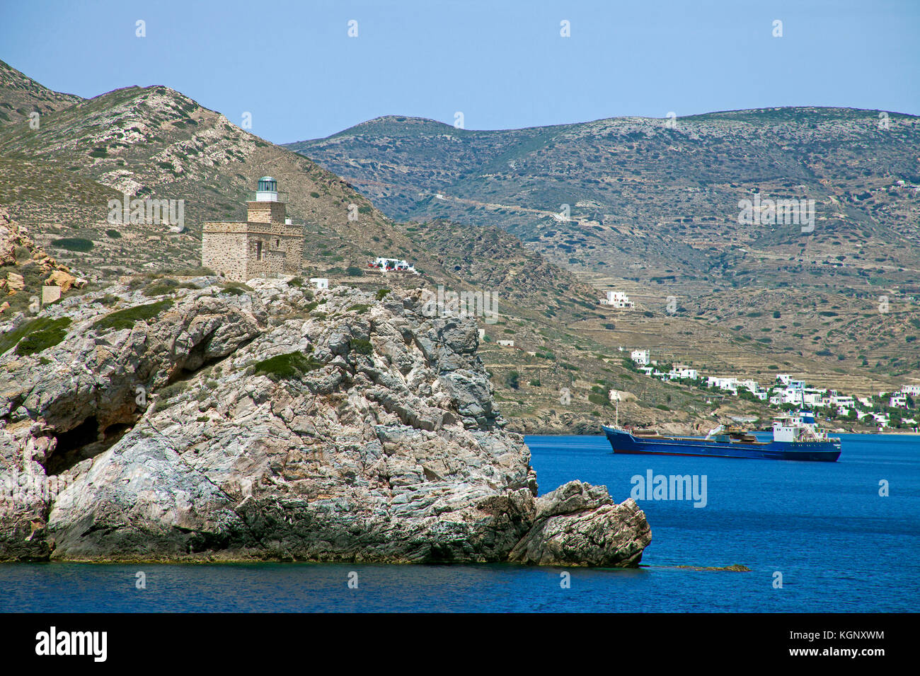 Faro e il paesaggio della costa a isola di Paros, Cicladi, Egeo, Grecia Foto Stock
