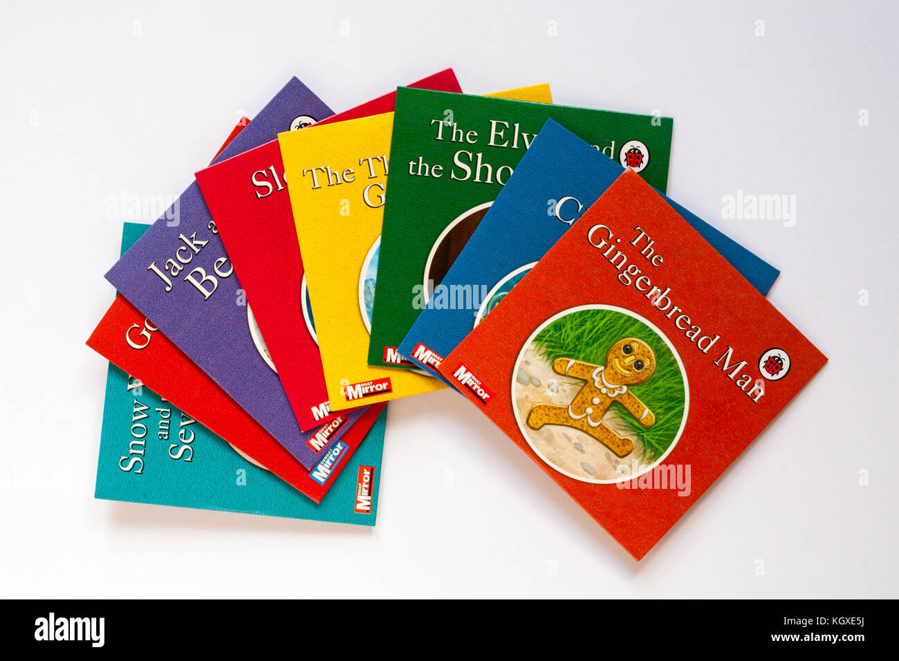 Selezione di Coccinella per bambini con dvd il Gingerbread Man disco sulla parte superiore isolata su sfondo bianco Foto Stock