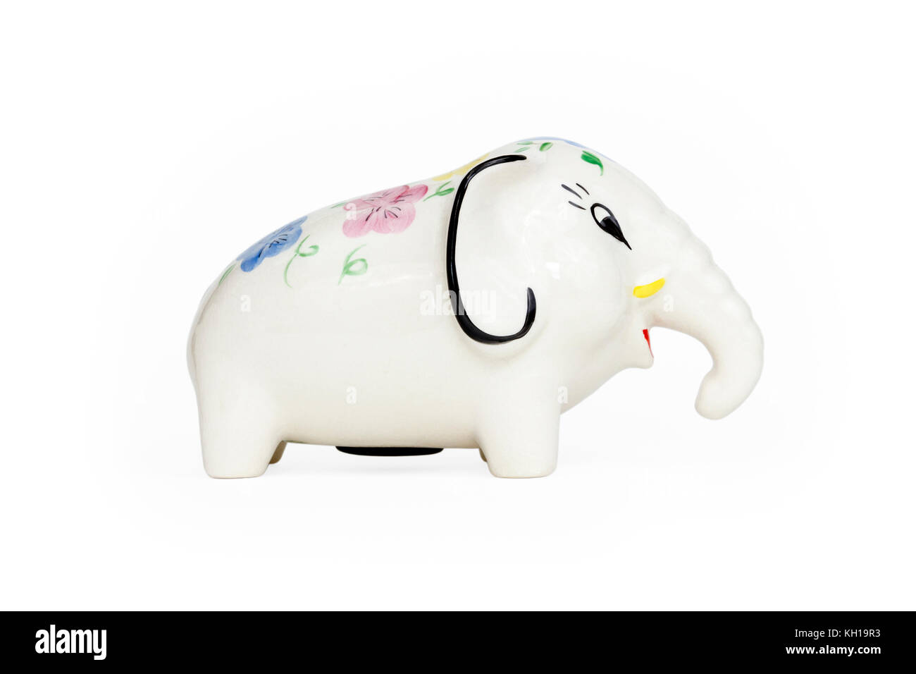 Una ceramica invetriata elefante scatola di denaro contro uno sfondo bianco Foto Stock