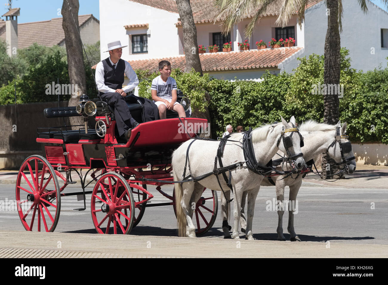 Padre e Figlio, Jerez de la Frontera, Feria de Caballo, Fiera del Cavallo di maggio, Cadice, Andalusia, Spagna. Foto Stock