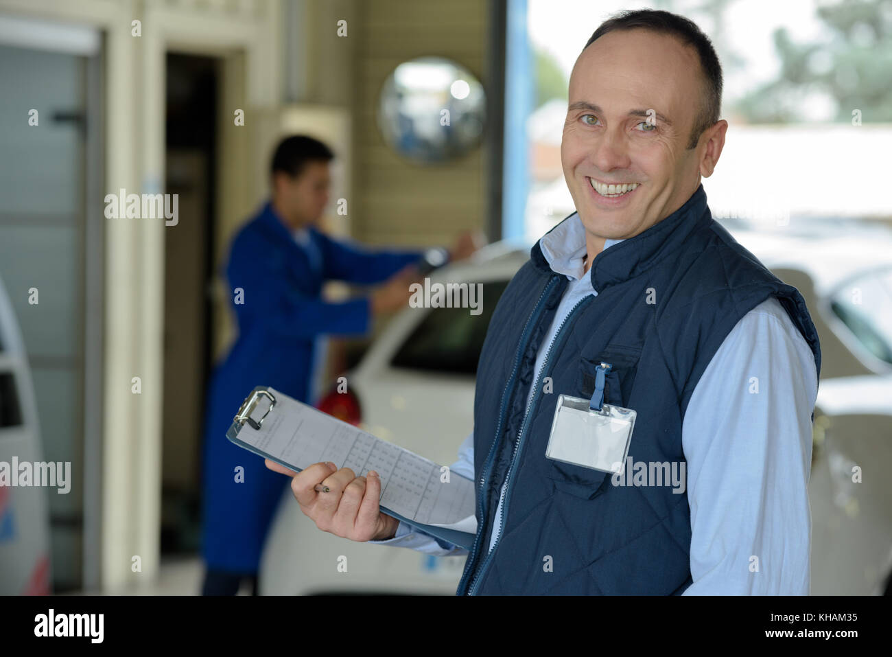 Sorridente supervisore meccanico Foto Stock