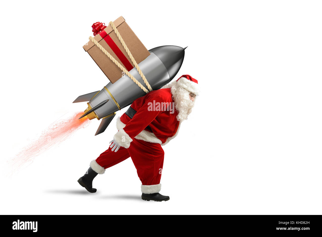 Consegna rapida di regali di Natale. santa claus pronto a volare con un razzo Foto Stock