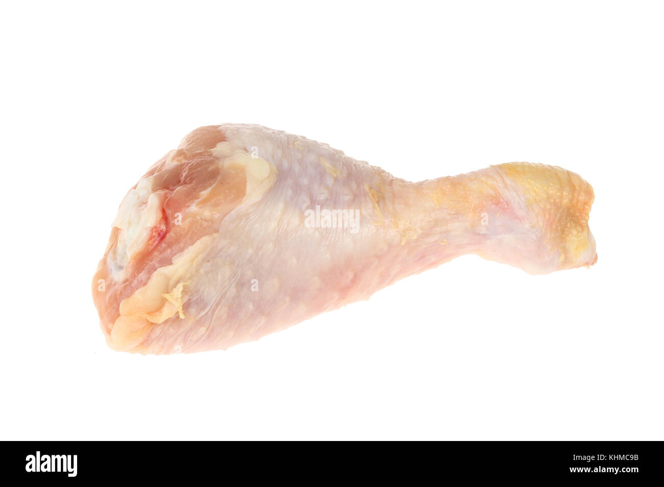 Il pollo crudo coscia isolata contro bianco Foto Stock