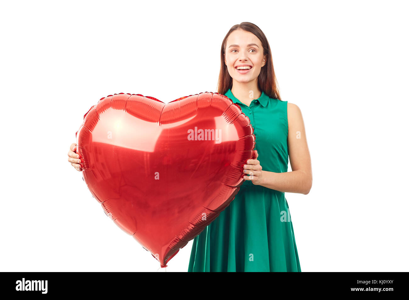 Donna con palloncino a forma di cuore Foto Stock