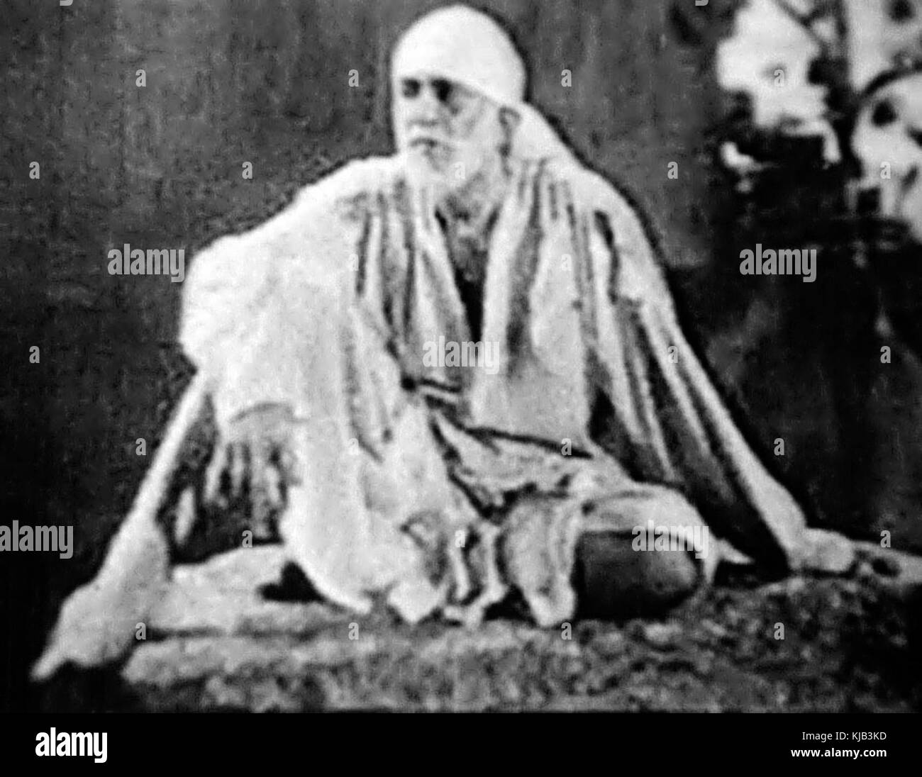 Shirdi Sai Baba seduto Foto Stock