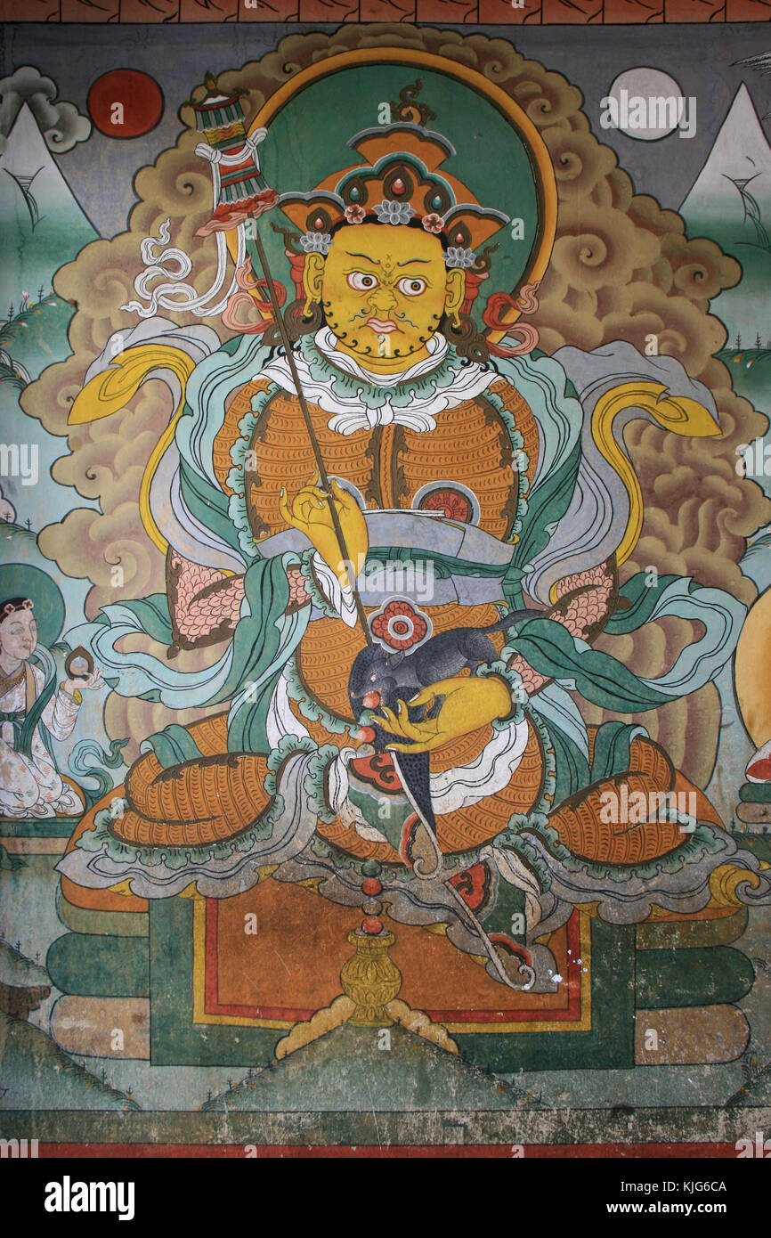 Pittura murale che rappresenta una divinità in un tempio buddista (Chimi Lhakang) a Lobesa (Bhutan). Foto Stock