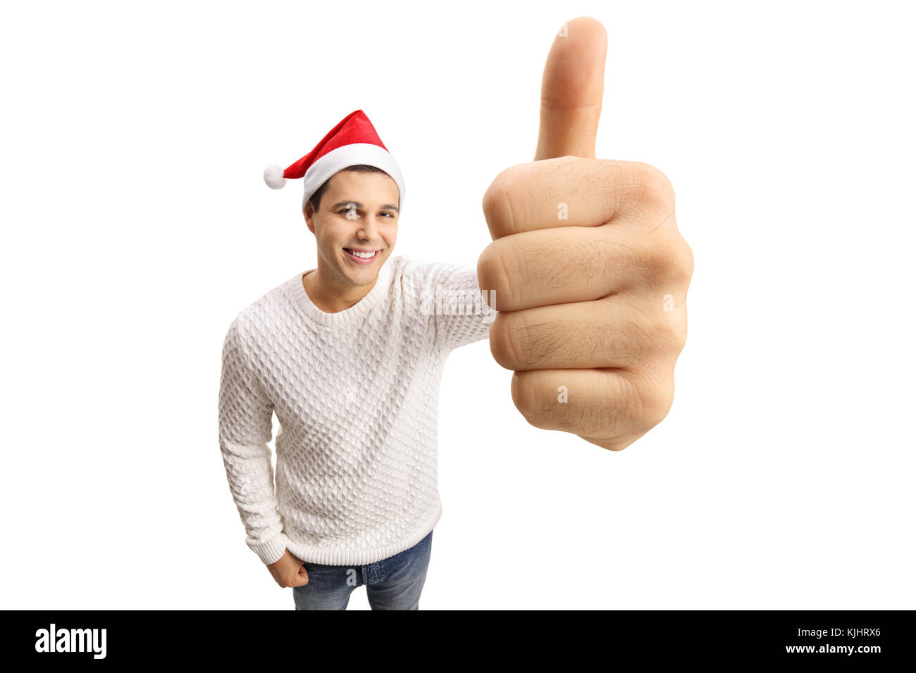 Giovane con un cappello di Natale facendo un pollice in alto segno isolato su sfondo bianco Foto Stock