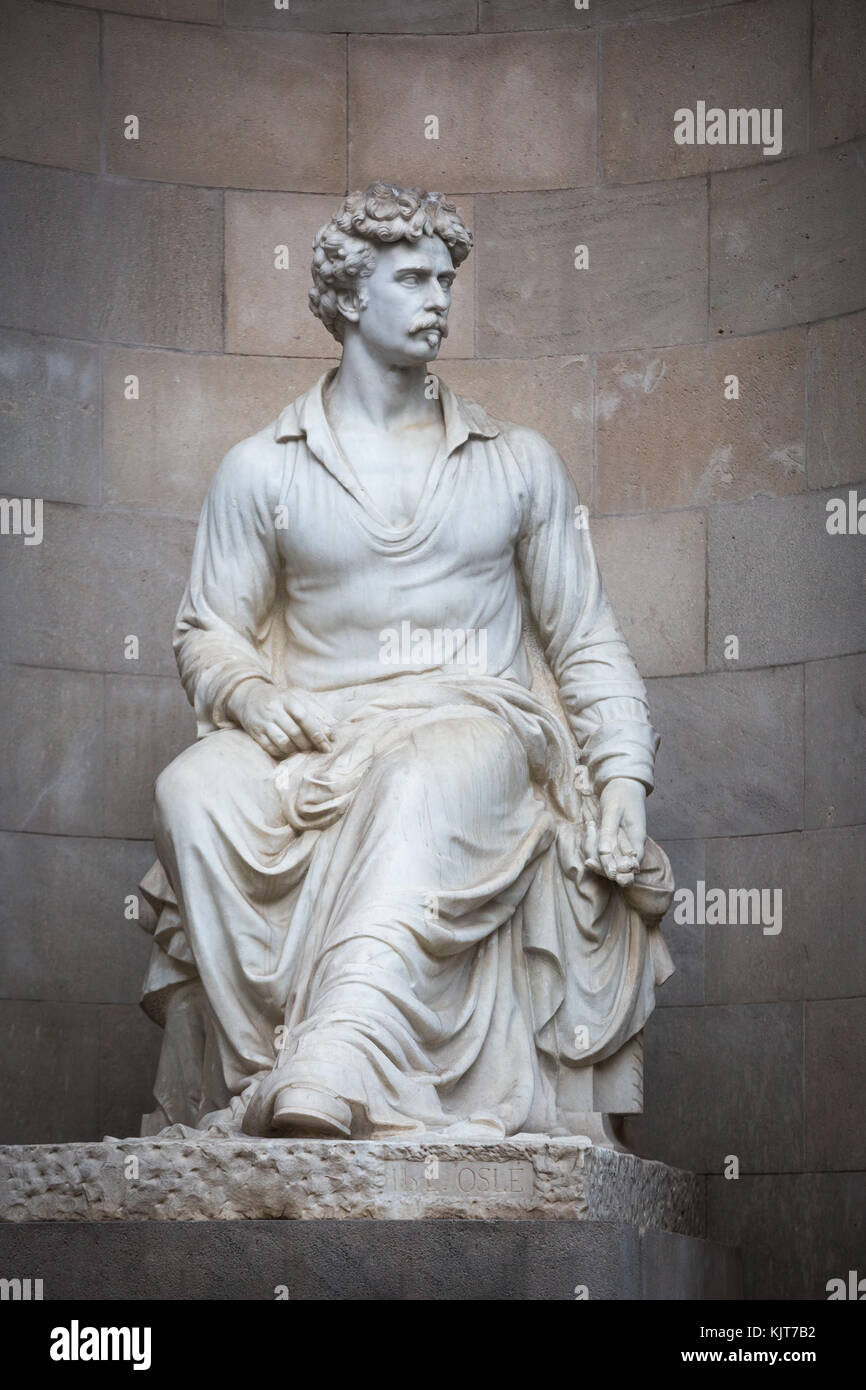 Seduta medievale maschio statua di pietra in Barcellona, Spagna Foto Stock