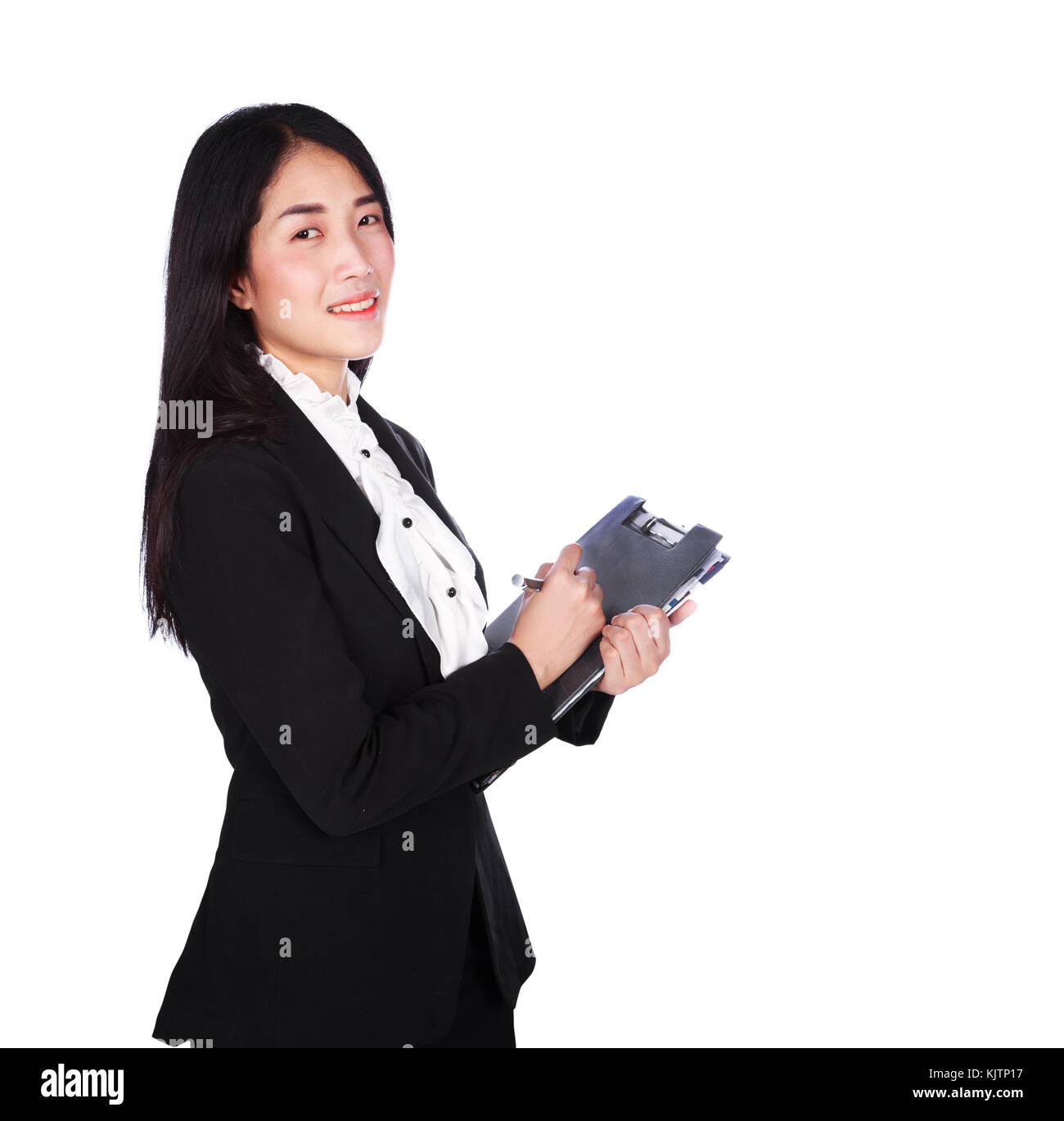 Young business woman in tuta la scrittura su un blocco appunti isolati su sfondo bianco Foto Stock