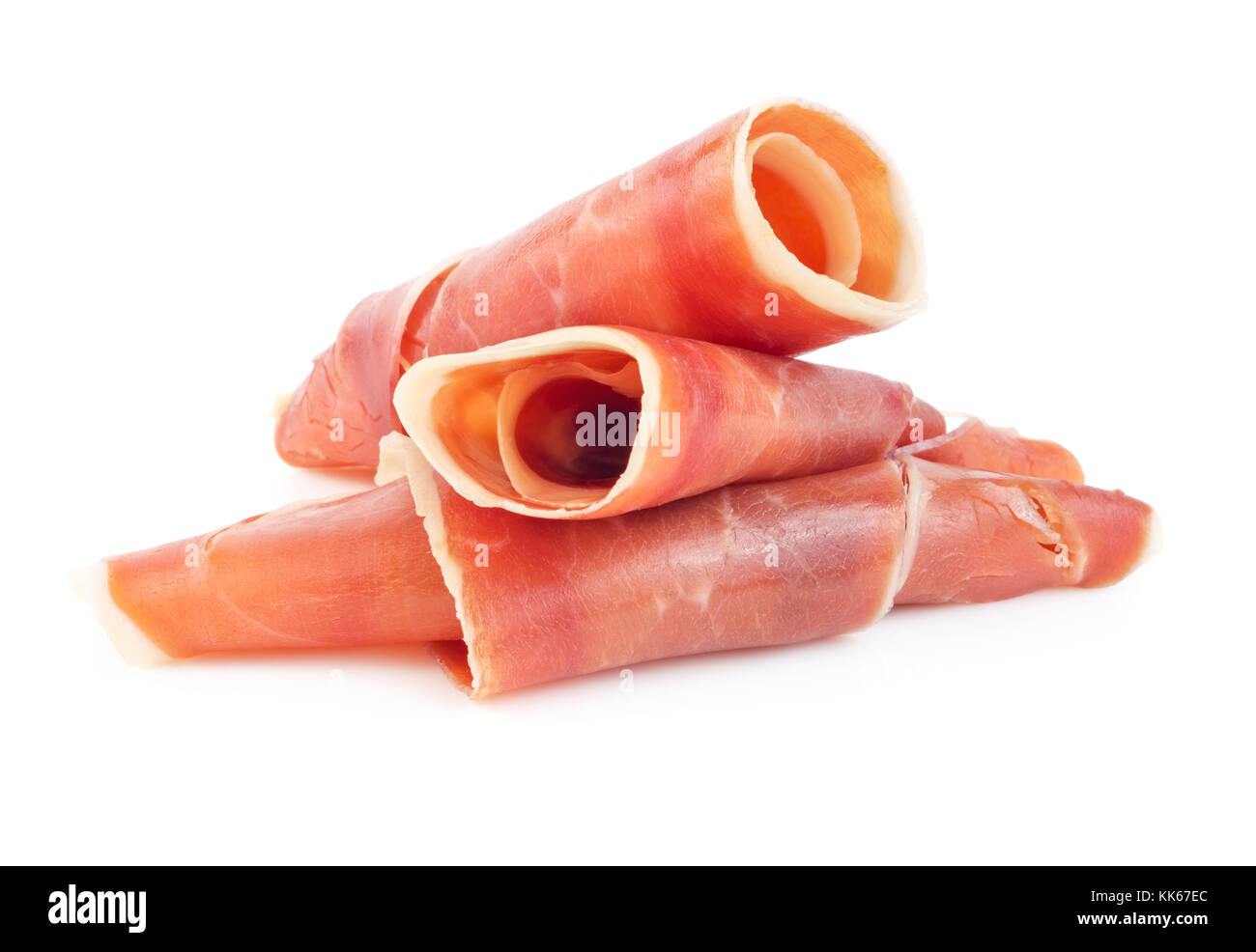 Rotoli di dry-cured spagnolo prosciutto Serrano isolati su sfondo bianco Foto Stock