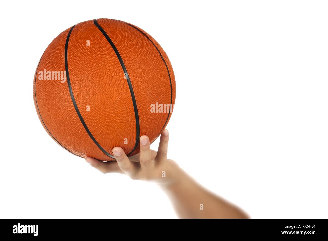 Mano umana tenendo la pallacanestro Foto Stock
