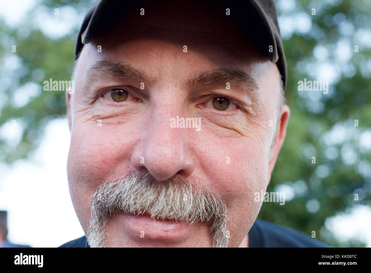 Chiudere su di una faccia di un uomo con un manubrio di baffi Foto Stock
