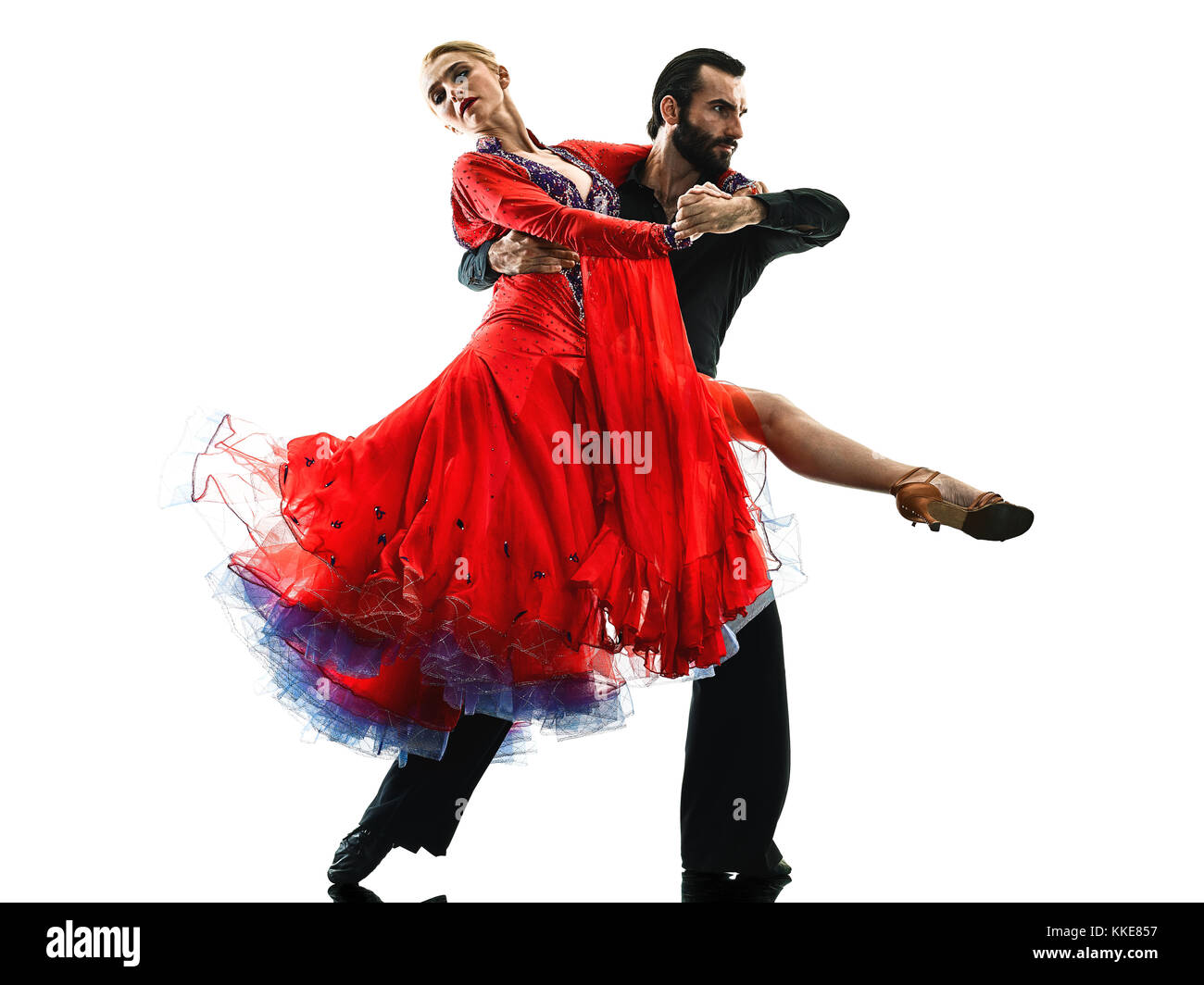 Un uomo caucasico e donna giovane sala da ballo tango ballerini di salsa dancing in studio silhouette isolati su sfondo bianco Foto Stock