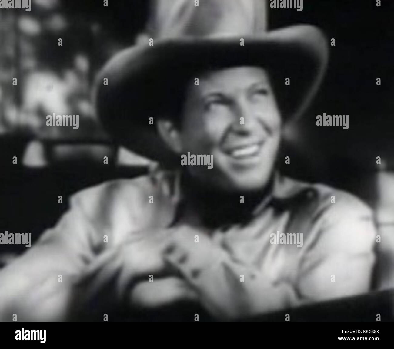 Questa immagine è un fermo ritagliato dal trailer del film *Cowboy from Brooklyn*, con Johnnie Davis. Il film è una commedia del 1938 su un uomo che viaggia nel West americano, con Davis nel ruolo principale. Foto Stock