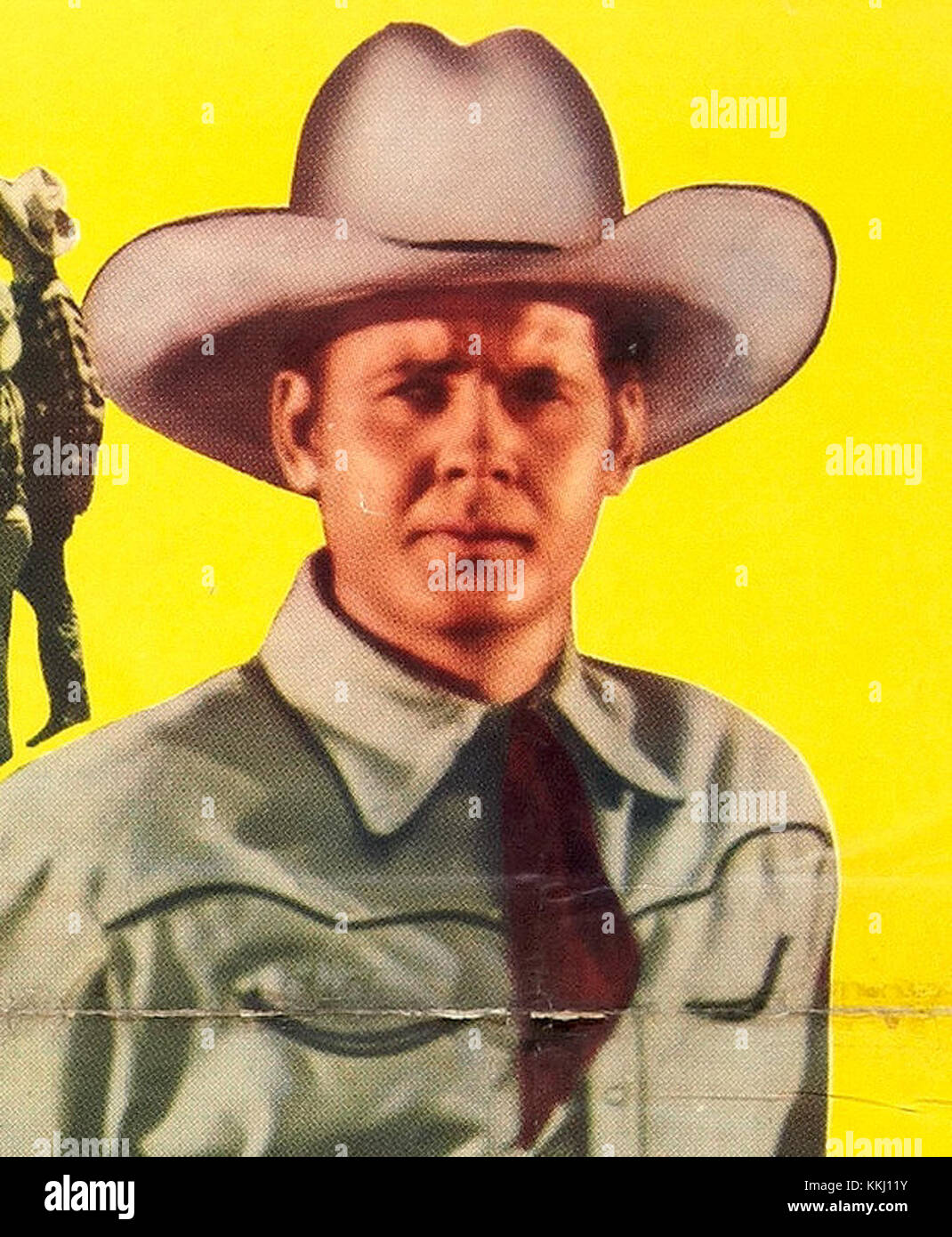 Un'immagine ritagliata di Sunset Carson, un attore cowboy americano e star del cinema degli anni '1940 Sunset Carson ha recitato in un certo numero di film occidentali ed è diventata una figura notevole nel genere Hollywood Western durante la metà del XX secolo. Foto Stock