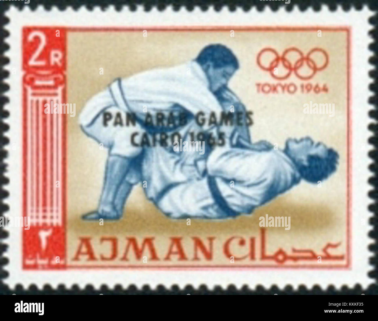 Il francobollo Ajman del 1965 commemora le Olimpiadi di Tokyo, evidenziando in particolare il judo come uno degli eventi presentati. Foto Stock