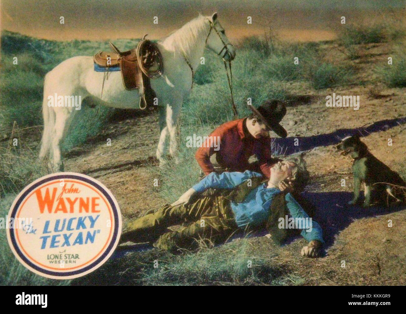 La lobby card per il film Lucky Texan (1924) presenta un'immagine promozionale del film muto WESTERN. Il film vede John Wayne in uno dei suoi primi ruoli, nel ruolo di un cowboy nella frontiera americana. Foto Stock