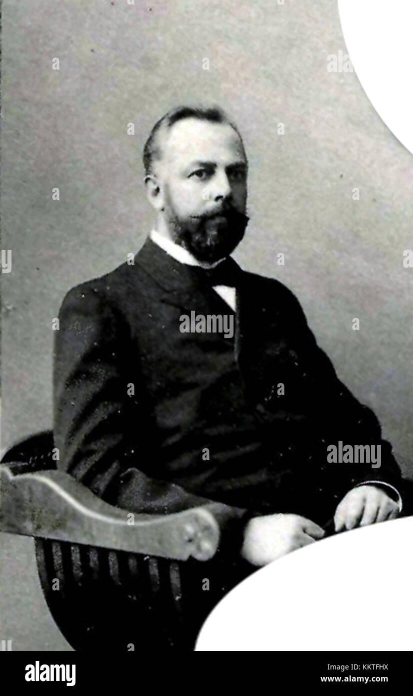 Un ritratto di yur Penskiy, un individuo distinto noto per i suoi contributi nel suo campo. La fotografia cattura un momento di calma intensità e professionalità mirata. Foto Stock