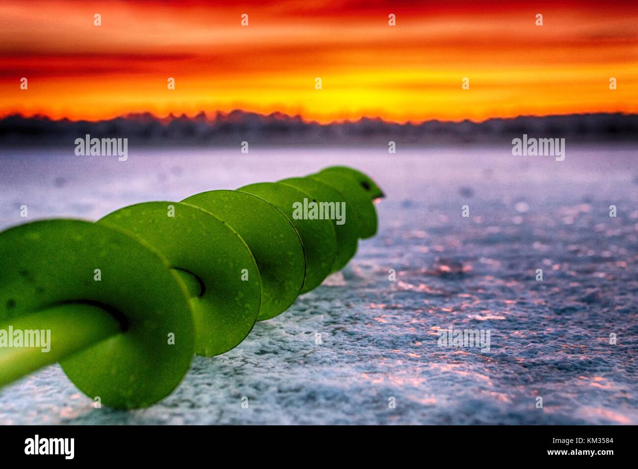 La pesca della coclea di ghiaccio Foto Stock