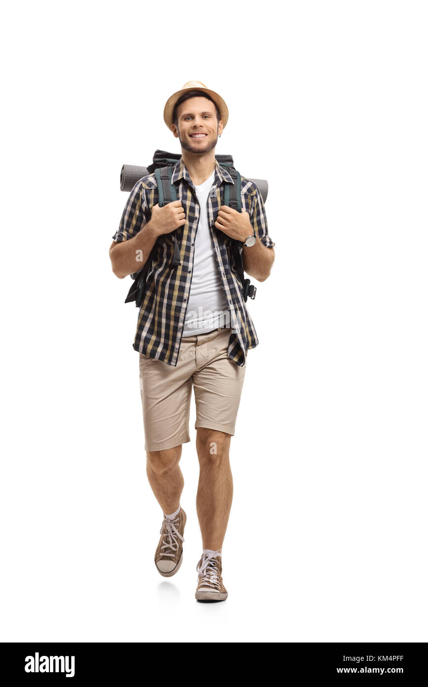 A piena lunghezza Ritratto di un turista con lo zaino in cammino verso la telecamera isolata su sfondo bianco Foto Stock