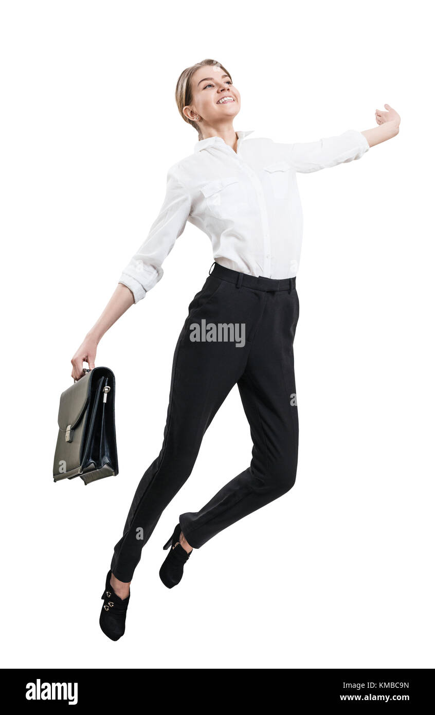 Felice giovane donna in abbigliamento formale jumping . Foto Stock
