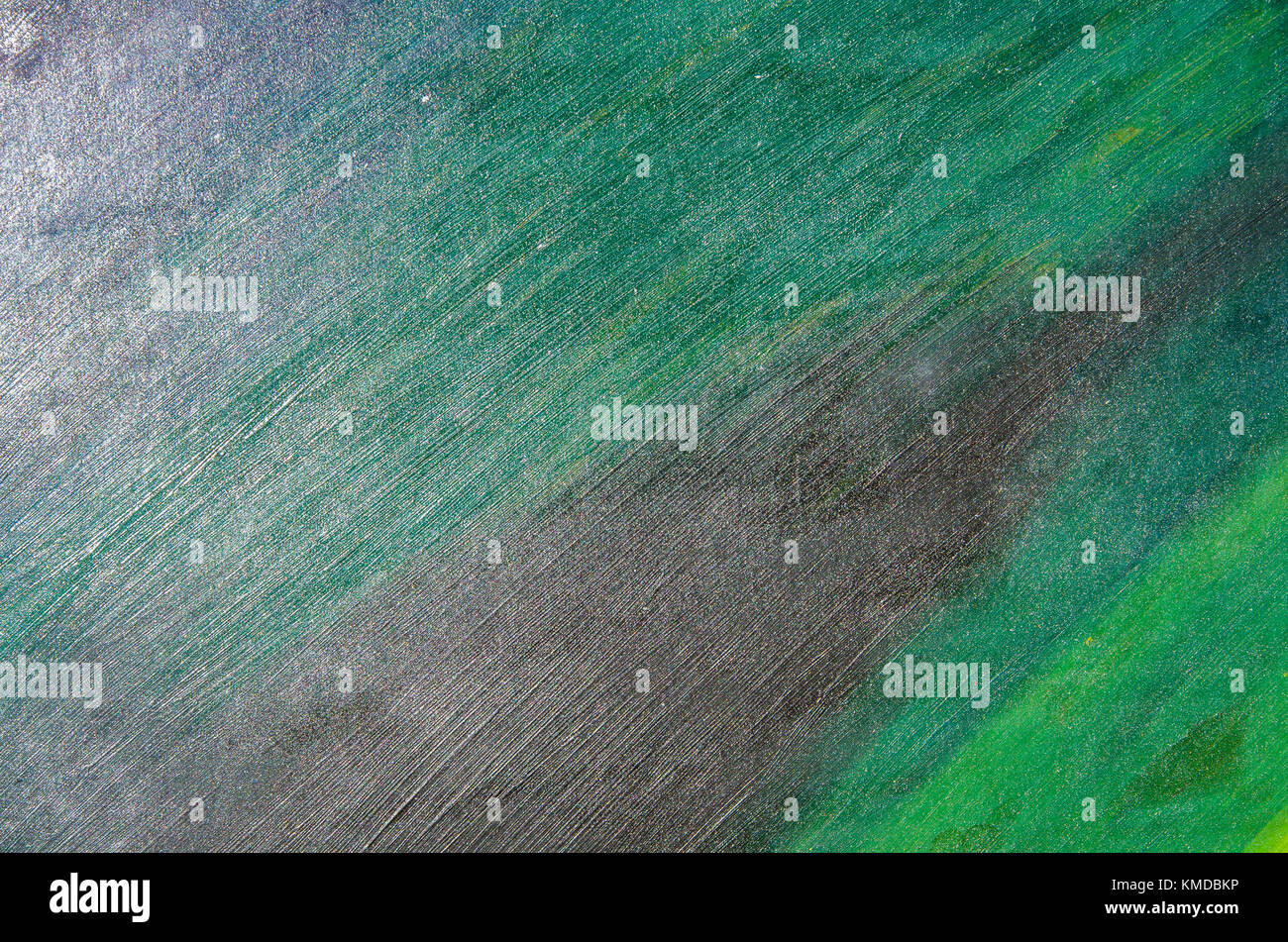 La tela di cartone è rivestita con una finitura opaca acquerello di vernice verde e nero Foto Stock