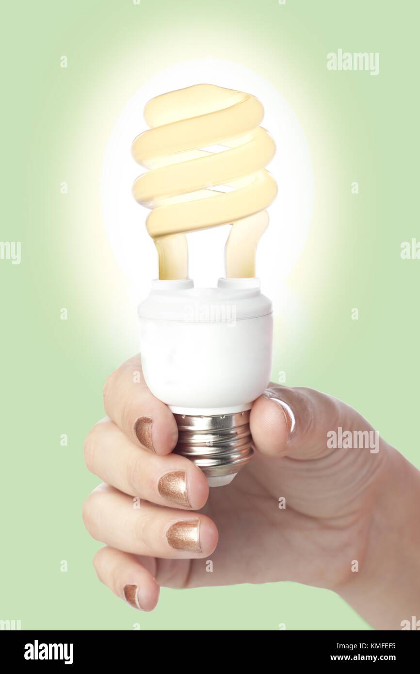 Un incandescente lampadina fluorescente Foto Stock