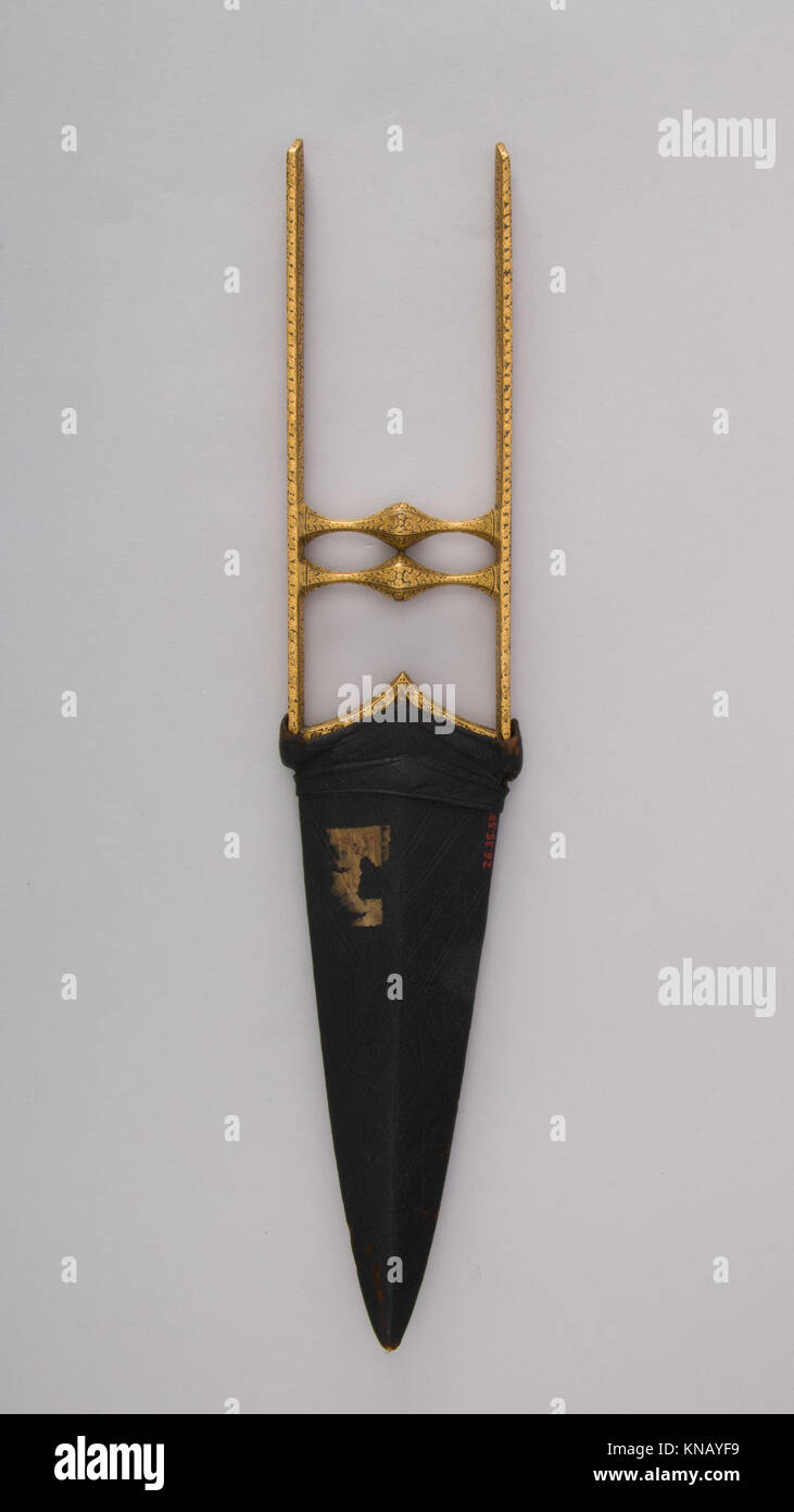Questo pugnale katar con guaina è un'arma tradizionale dell'Asia meridionale, che riflette l'artigianato e il design marziali regionali. Foto Stock