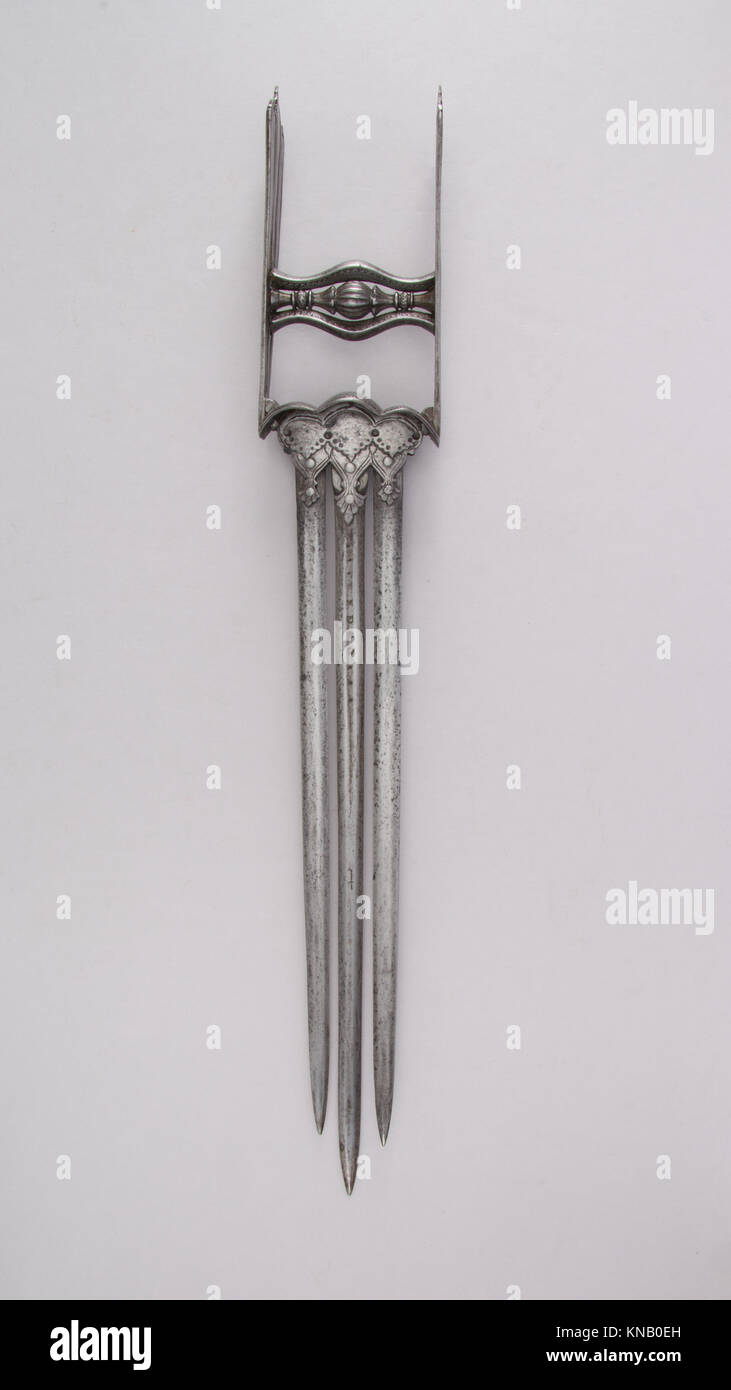 Questo pugnale katar ha un'ampia lama e un'impugnatura che riflette la cultura marziale e la maestria artigianale del suo periodo. Foto Stock