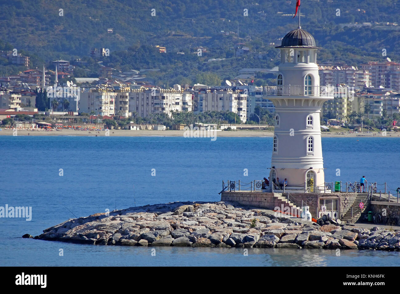 Faro all'entrata del porto, Alanya, riviera turca, Turchia Foto Stock