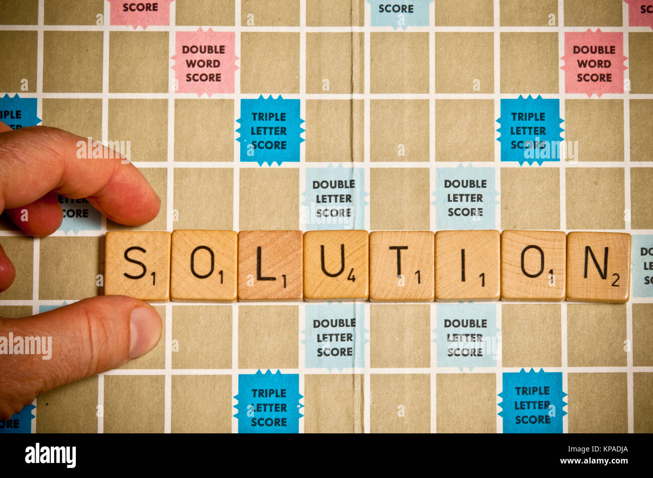 Soluzione word scritto con piastrelle di scrabble Foto Stock